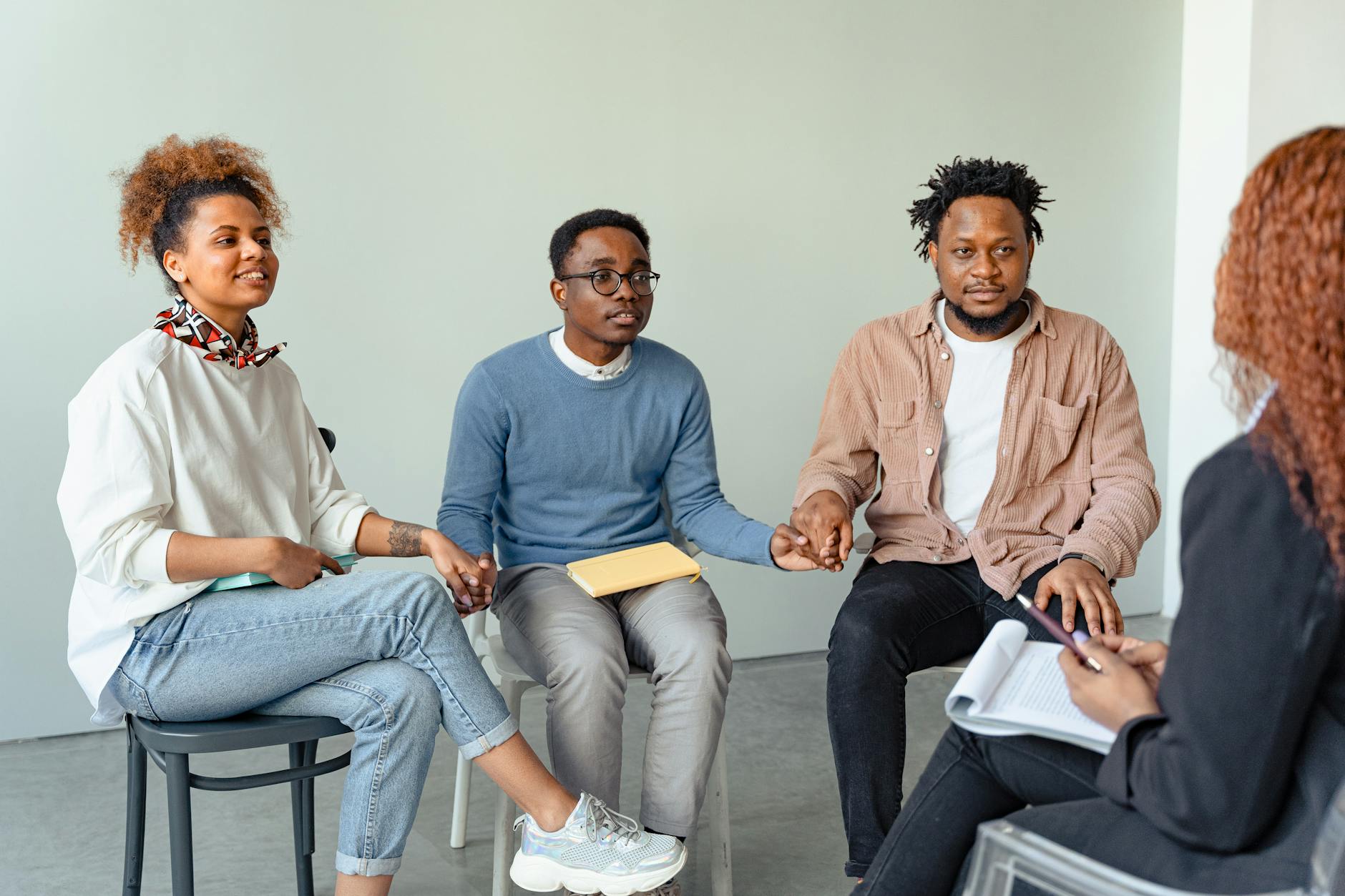 A diverse group of people preparing for a wellness session.